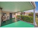 Relaxing carport seating area with wicker chairs at 665 Park Cir # 58, Bradenton, FL 34207