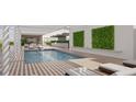 Relaxing rooftop pool and deck area with lounge chairs and a pergola at 1305 4Th St # 402A, Sarasota, FL 34236