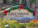 Greenbrook Village entrance sign decorated for the holidays at 15230 Searobbin Dr, Lakewood Ranch, FL 34202