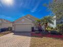 House exterior view with a paved driveway and palm trees at 15230 Searobbin Dr, Lakewood Ranch, FL 34202