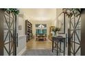 Bright dining room features hardwood floors and chandelier at 1598 Oak N Cir, Sarasota, FL 34232