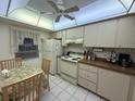 Bright kitchen with appliances and dining area at 2609 Woodgate Ln # K4, Sarasota, FL 34231