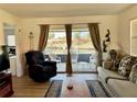 Living room with water views, featuring comfortable seating and a coffee table at 4104 Catalina Dr, Bradenton, FL 34210