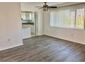 Bright living room with wood-look floors and kitchen view at 4480 Ironwood Cir # 218A, Bradenton, FL 34209