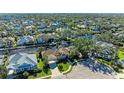 Bird's-eye view of a waterfront community with houses and canals at 4712 Compass Dr, Bradenton, FL 34208