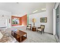 Bright living room with ample natural light and access to other rooms at 6001 Cedarwood Ln, Bradenton, FL 34203