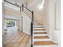 Elegant staircase with a modern design and wooden steps at 6364 Golden Eye Gln, Lakewood Ranch, FL 34202