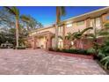 Two-story house with brick facade, palm trees, and a spacious driveway at 7800 18Th W Ave, Bradenton, FL 34209