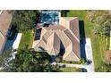 Bird's eye view of the house, highlighting the backyard, pool, and surrounding trees at 8532 Eagle Preserve Way, Sarasota, FL 34241