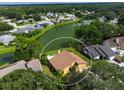 Bird's eye view of a house near a lake in a residential area at 3888 Shady Brook Ln, Sarasota, FL 34243