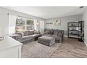 Cozy living room featuring a sectional sofa and a modern aesthetic at 5517 24Th N Ave, St Petersburg, FL 33710