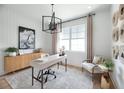 Home office with built-in cabinetry and a large window at 9981 Key Haven Rd, Seminole, FL 33777