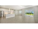 Open concept kitchen with stainless steel appliances and an island at 10300 Lake George Ave, Sarasota, FL 34241