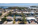 Bird's-eye view of single-story home, showcasing its canal-front location at 10307 Sandpiper W Rd, Bradenton, FL 34209