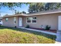 Front view of charming house, featuring a walkway and landscaping at 12302 Tangier St, North Port, FL 34287