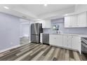 Modern kitchen with stainless steel appliances and white cabinets at 12302 Tangier St, North Port, FL 34287