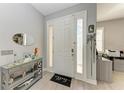 Inviting foyer with stylish decor and ample natural light at 13951 Wood Duck Cir, Lakewood Ranch, FL 34202