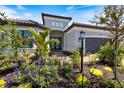 Attractive single-story home featuring manicured landscaping and a neutral color scheme at 15603 Derna Ter, Bradenton, FL 34211