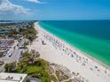 Aerial view of beach with people and volleyball court at 4307 Gulf Dr # 103, Holmes Beach, FL 34217