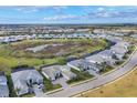 Aerial perspective of a residential neighborhood with houses and green areas at 7940 Redonda Loop, Bradenton, FL 34202
