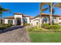 One-story home with paver driveway & landscaped yard at 10817 Whisk Fern Dr, Venice, FL 34293