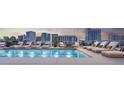 Rooftop pool with city views, surrounded by lounge chairs for relaxation at 1305 4Th St # 402P, Sarasota, FL 34236