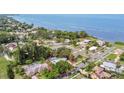 An aerial view showcasing the home's location in a waterfront neighborhood at 214 Gaines Ave, Sarasota, FL 34243