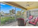 Relaxing screened porch overlooking waterfront with seating at 2251 Jessie Harbor Dr # 2101, Osprey, FL 34229