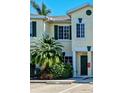 Front view of a townhouse with landscaping and parking at 227 Cape Harbour Loop # 103, Bradenton, FL 34212