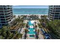 Resort-style pool and sundeck with beach access at 415 L Ambiance Dr # A801, Longboat Key, FL 34228