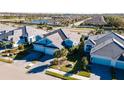 Community view showing houses with gray roofs and blue exteriors at 4326 Tamarind Pl, Bradenton, FL 34203