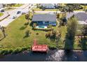Aerial view of canal-front property with dock at 527 Rotonda Cir, Rotonda West, FL 33947