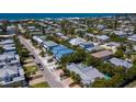 Aerial view of a neighborhood near the beach, showcasing a three-unit building at 303 65Th St # B, Holmes Beach, FL 34217