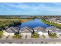 Aerial view of homes on the water with pristine landscaping and access to lake at 3115 Trustee Ave, Sarasota, FL 34243