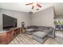 Relaxing living room with a sectional sofa and hardwood floors at 4239 Durant St, Port Charlotte, FL 33948