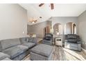 Spacious living room featuring a sectional sofa and large TV at 4239 Durant St, Port Charlotte, FL 33948