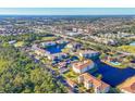Aerial view of community, featuring a lake and multiple buildings at 500 San Lino Cir # 511, Venice, FL 34292