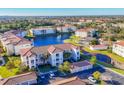 Condo building near a lake with ample parking and landscaping at 500 San Lino Cir # 511, Venice, FL 34292