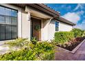 Inviting front door entrance with a wreath and welcome sign at 6226 Plateau Ct, Bradenton, FL 34203