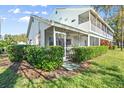Private screened porch surrounded by green hedges at 6640 Pineview Ter # 6640, Bradenton, FL 34203