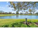 Scenic golf course view with pond and trees at 6640 Pineview Ter # 6640, Bradenton, FL 34203