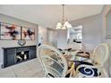 Charming dining area with glass-top table and wicker chairs at 676 Park Cir, Bradenton, FL 34207