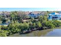Private dock with seating area in a lush waterfront community at 850 S Tamiami Trl # 402, Sarasota, FL 34236
