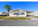 Front view of a manufactured home with a carport at 1111 49Th Avenue W Dr, Bradenton, FL 34207
