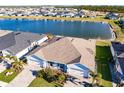 An aerial view of the home by the lake in the community at 16351 Coconut Palm Dr, Port Charlotte, FL 33953