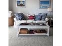 Living room features a beige sofa and white coffee table at 1714 69Th W Ave # A207, Bradenton, FL 34207