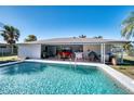 Sparkling pool with a spacious patio and grill area at 18671 Macgill Ave, Port Charlotte, FL 33948