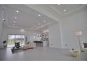 Open concept living space with modern kitchen and access to backyard pool at 230 W Pine Valley Ln, Rotonda West, FL 33947