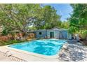 Relaxing rectangular swimming pool in a backyard setting at 2574 Hawthorne St, Sarasota, FL 34239