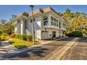 Modern condo with two-car garage and private entrance at 575 Sutton Pl # T-4, Longboat Key, FL 34228